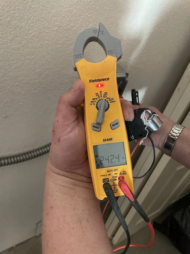 Voltage testing with clamp meter during Generator Installation in Steiner Ranch